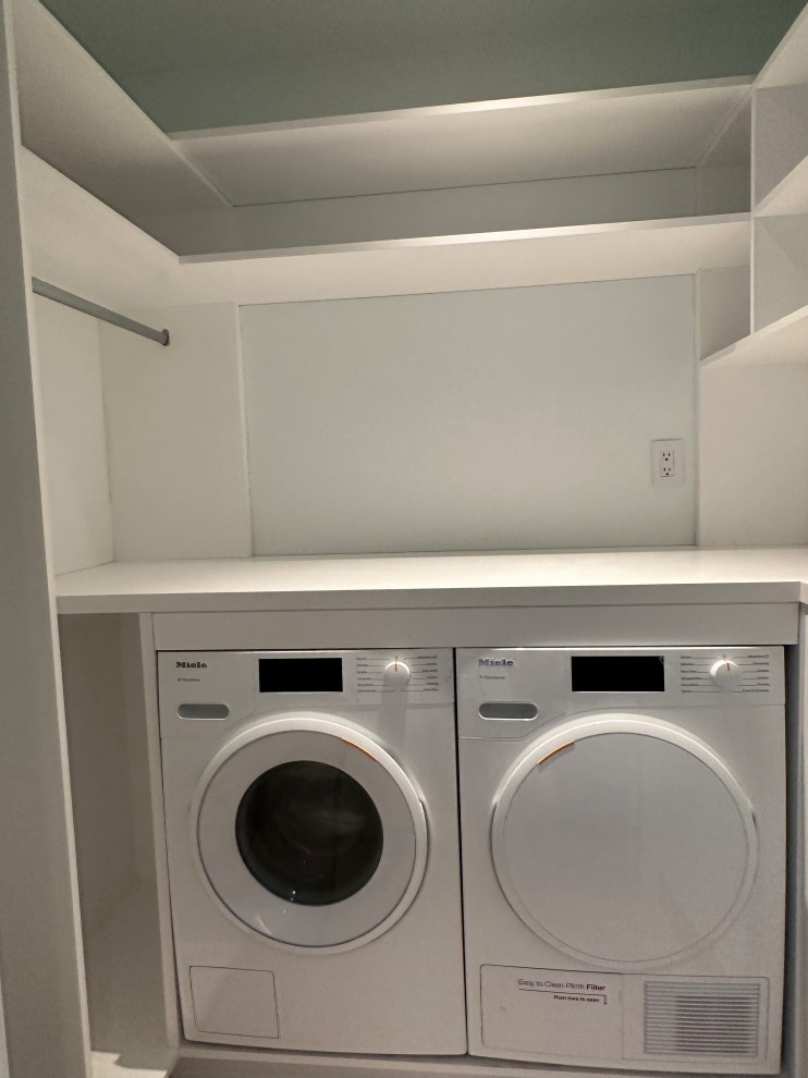 Inspiration for a small modern single-wall laundry cupboard in Other with open cabinets, white cabinets, wood worktops, white walls, slate flooring, a side by side washer and dryer, grey floors and white worktops.