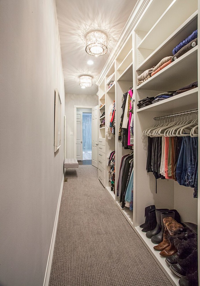 Design ideas for a mid-sized transitional women's walk-in wardrobe in Dallas with flat-panel cabinets, white cabinets, carpet and grey floor.