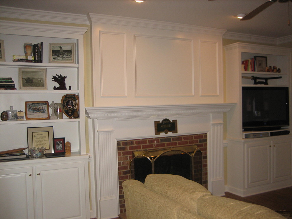 This is an example of a traditional family room in Raleigh.