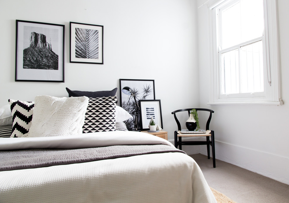 Inspiration for a scandinavian bedroom in Sydney with white walls, carpet and beige floor.