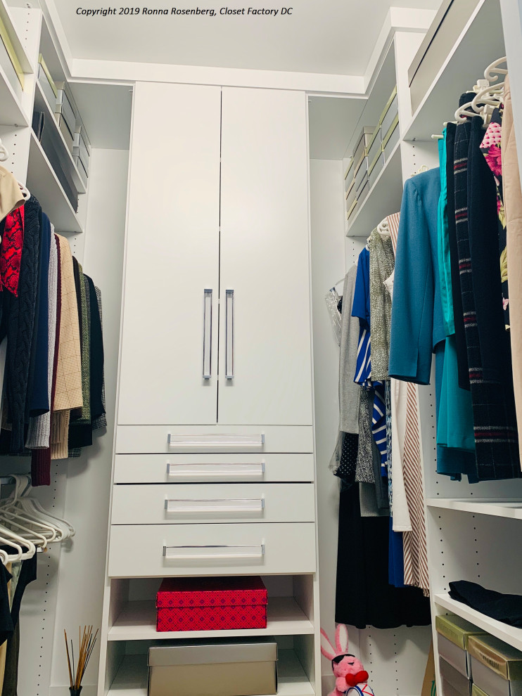 Small modern gender-neutral walk-in wardrobe in DC Metro with flat-panel cabinets and white cabinets.