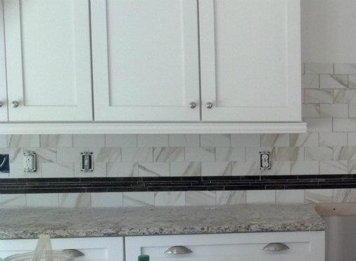 Transitional kitchen photo in Raleigh with granite countertops, multicolored backsplash and ceramic backsplash