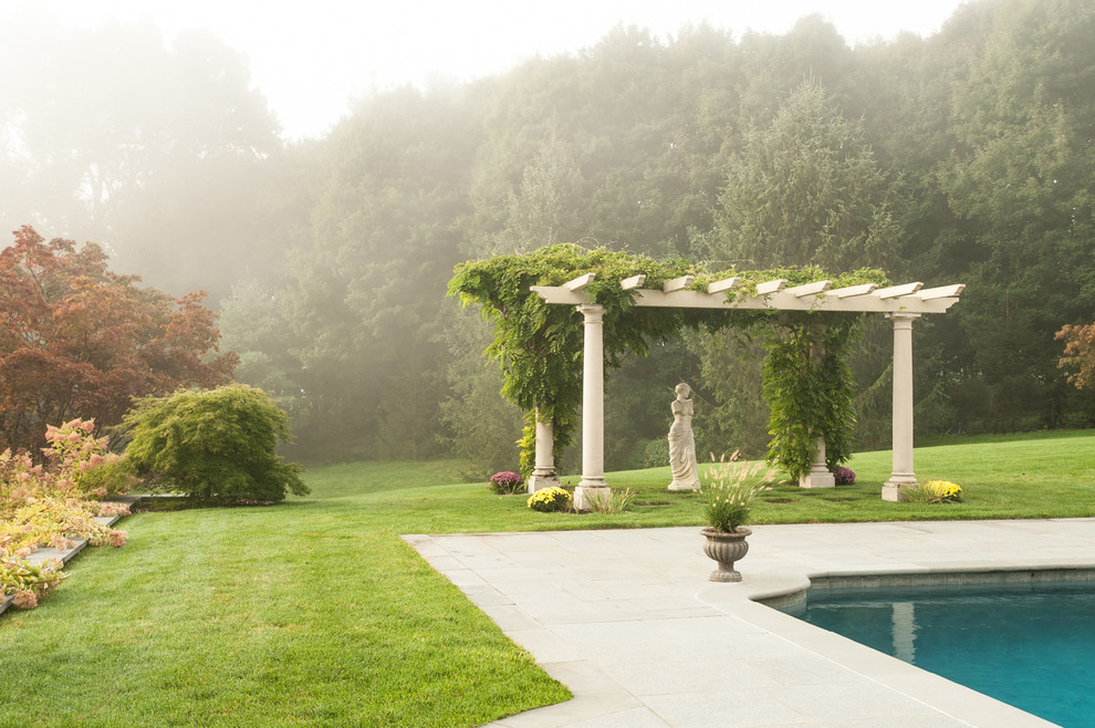 Design ideas for a large traditional side yard pool in New York.