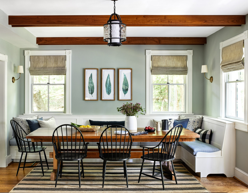 Design ideas for a country dining room in DC Metro with grey walls, medium hardwood floors, brown floor and exposed beam.