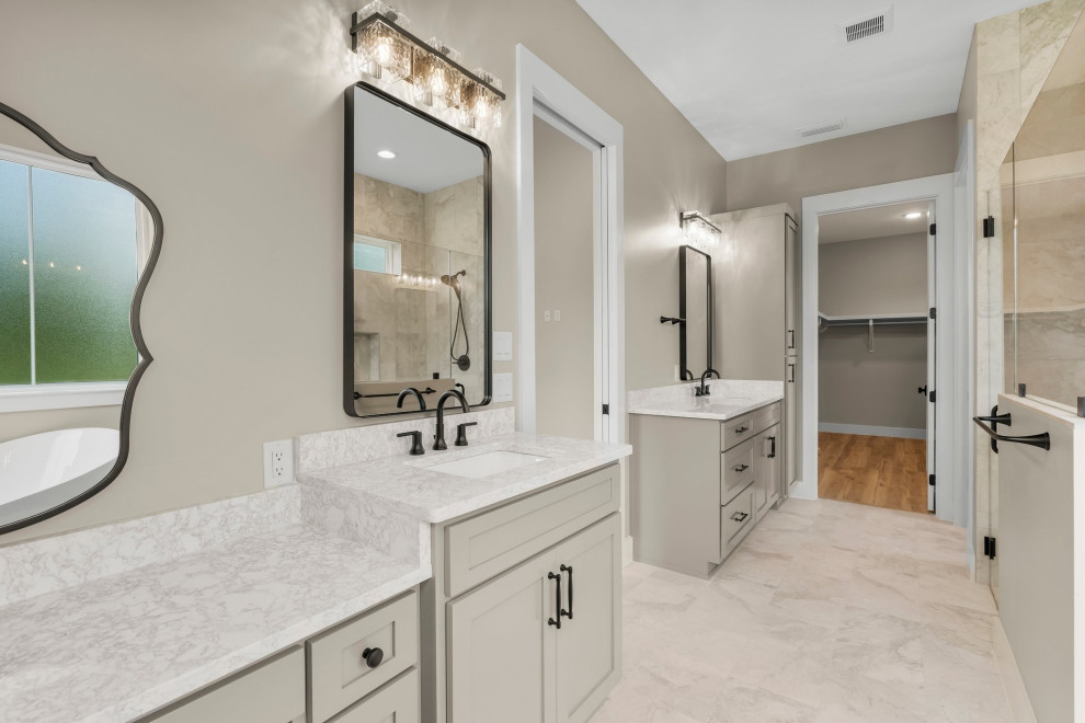 Inspiration for a mid-sized craftsman master beige tile and porcelain tile porcelain tile, beige floor and double-sink freestanding bathtub remodel with shaker cabinets, beige cabinets, a two-piece toilet, beige walls, an undermount sink, quartzite countertops, a hinged shower door, beige countertops and a built-in vanity