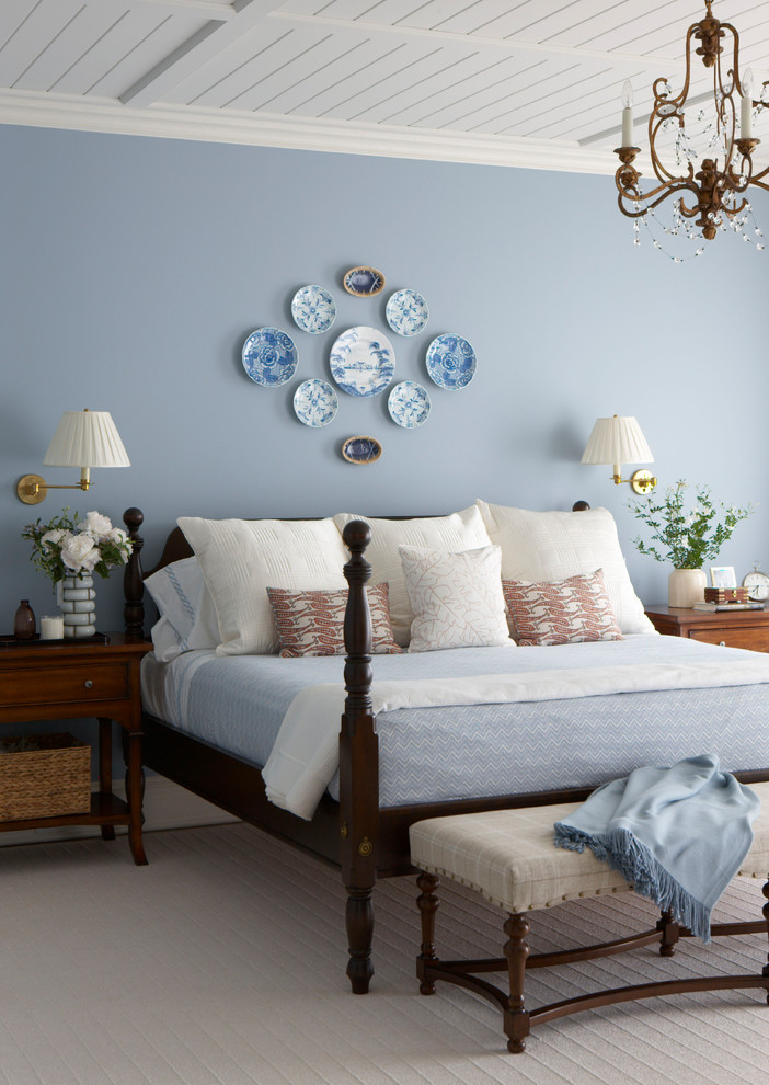 Elegant carpeted and gray floor bedroom photo in New York with blue walls