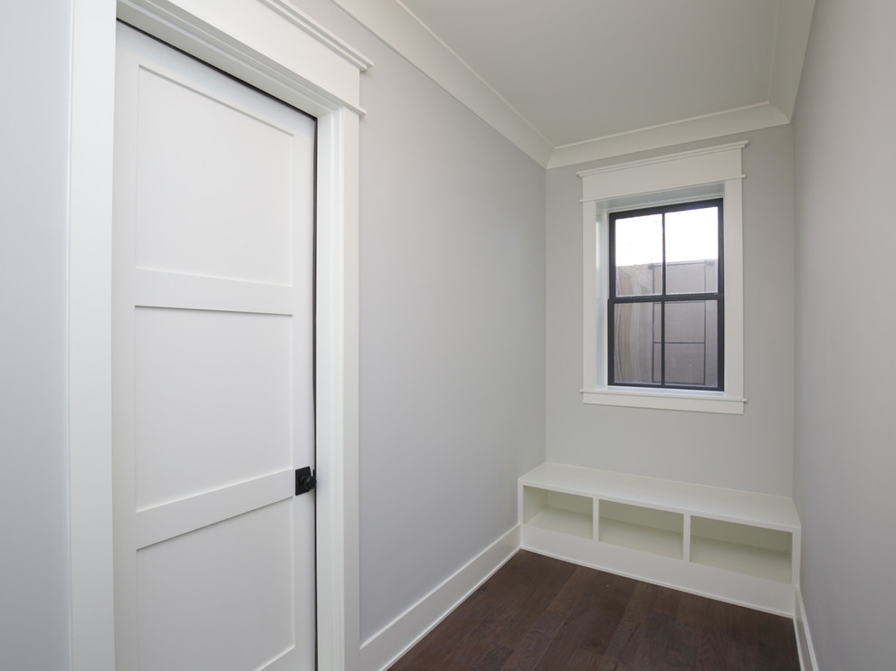 Small transitional hallway in Raleigh with grey walls, brown floor and dark hardwood floors.