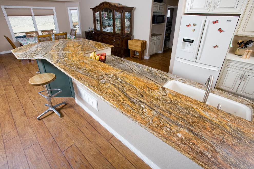 Example of a transitional kitchen design in Denver