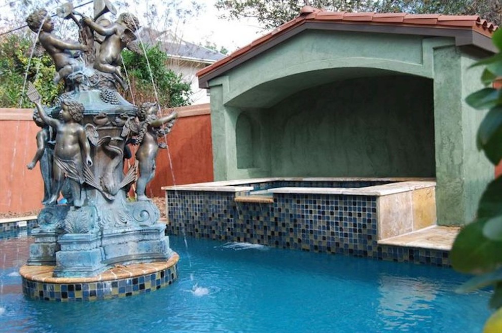 Inspiration for a mid-sized backyard stone and rectangular natural pool fountain remodel