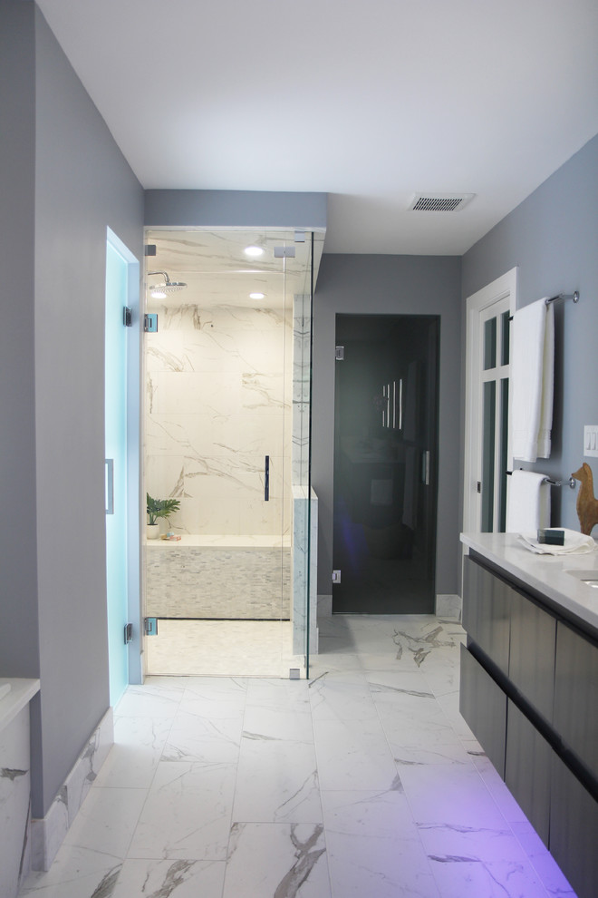 Inspiration for a mid-sized modern master bathroom in Atlanta with flat-panel cabinets, medium wood cabinets, a drop-in tub, a curbless shower, a bidet, black and white tile, porcelain tile, grey walls, porcelain floors, an undermount sink, engineered quartz benchtops, white floor, a hinged shower door and white benchtops.