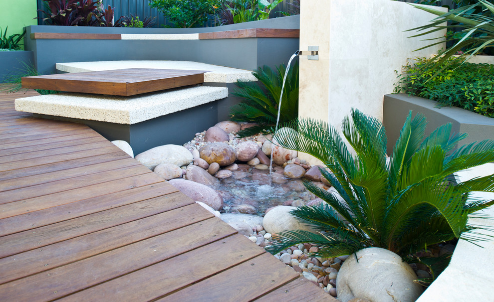 Small contemporary backyard full sun garden in Perth with a water feature and decking.