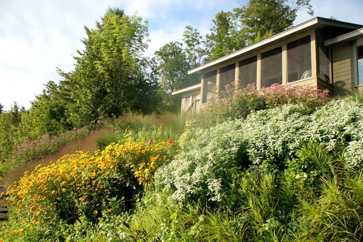 Inspiration for a traditional backyard partial sun garden in Burlington with a garden path and mulch.