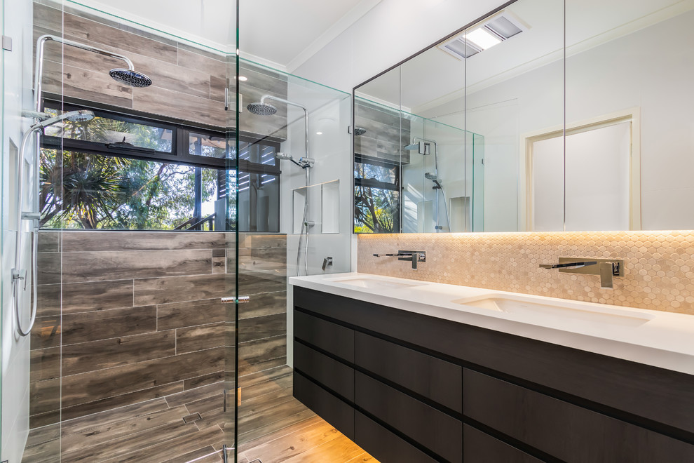 Design ideas for a mid-sized contemporary master bathroom in Brisbane with dark wood cabinets, a double shower, orange tile, mosaic tile, grey walls, porcelain floors, an undermount sink, engineered quartz benchtops, grey floor, a hinged shower door, white benchtops and flat-panel cabinets.
