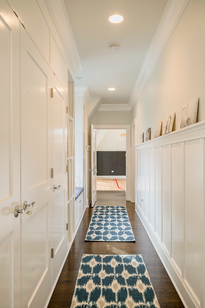 This is an example of a mid-sized transitional hallway in Chicago with grey walls and medium hardwood floors.