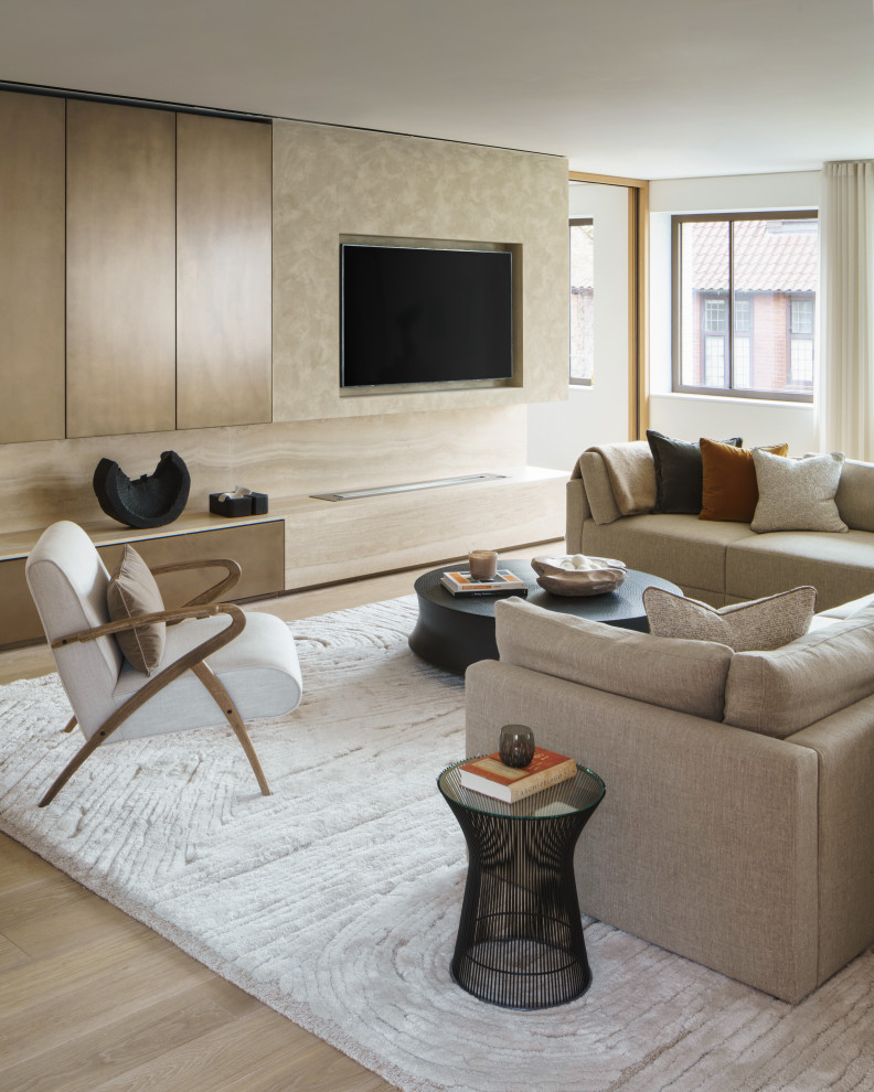 Photo of a mid-sized contemporary open concept living room in London with beige walls.