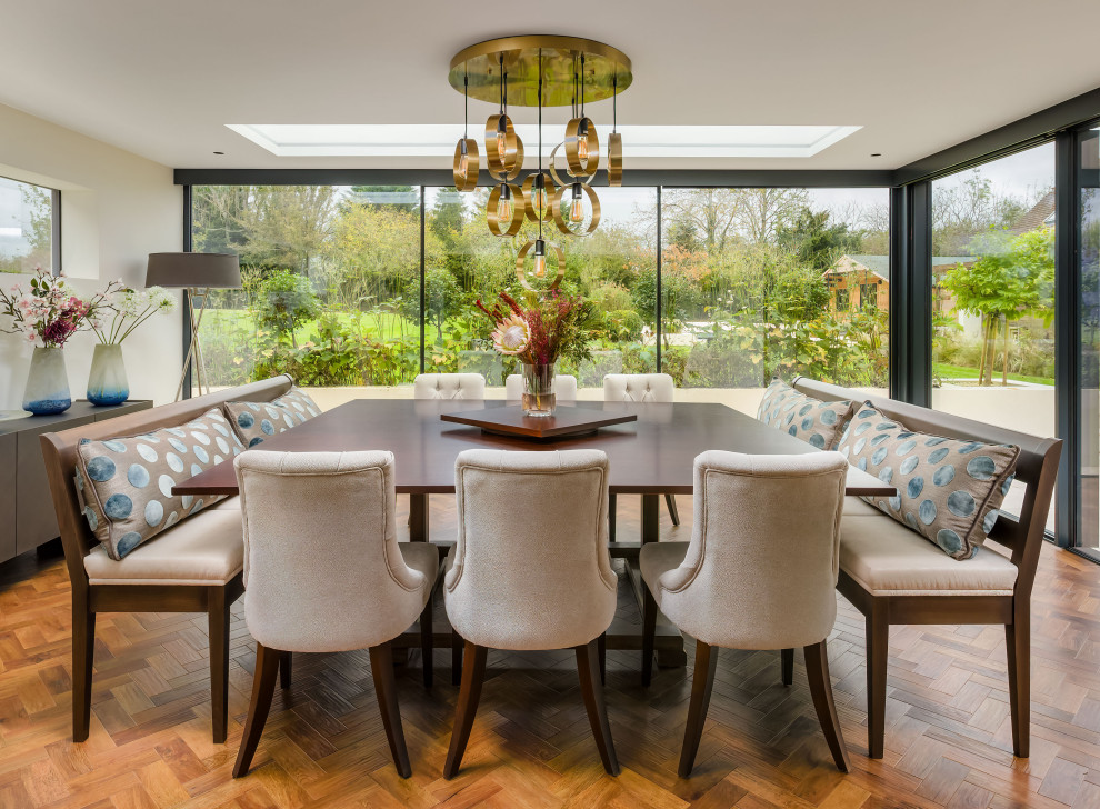 Photo of a large transitional dining room in Sussex.