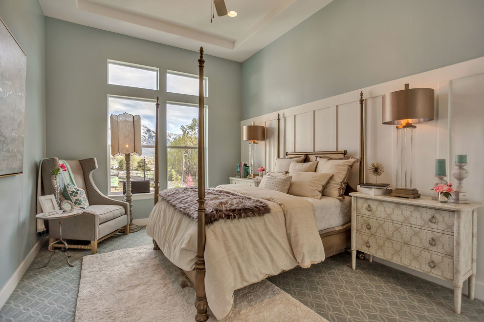 This is an example of a transitional master bedroom in Salt Lake City with green walls and carpet.