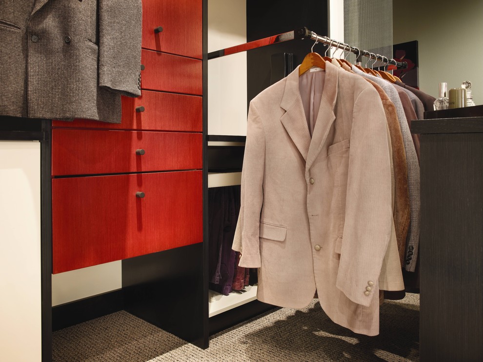 Design ideas for a large contemporary gender-neutral walk-in wardrobe in Houston with flat-panel cabinets, red cabinets, carpet and beige floor.