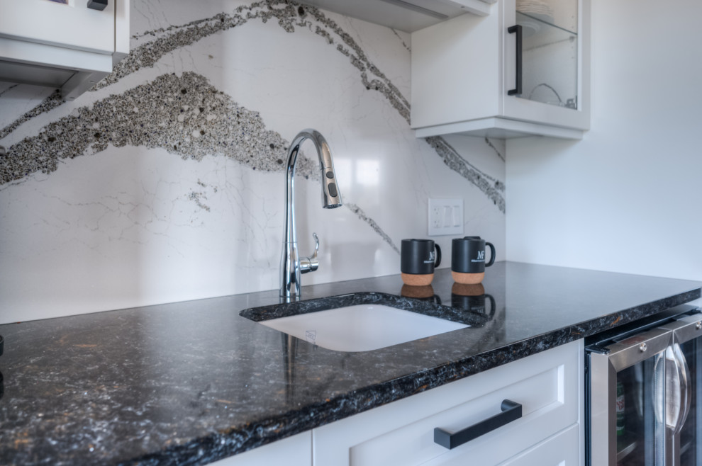Inspiration for a transitional eat-in kitchen remodel with shaker cabinets, white cabinets, stainless steel appliances and an island