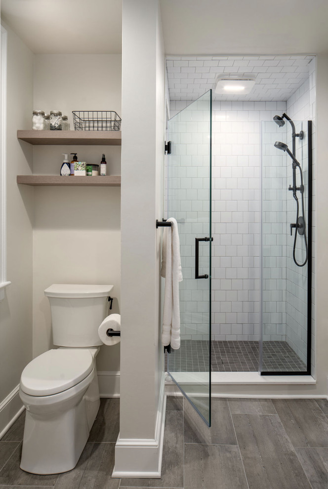 Large transitional master white tile and ceramic tile porcelain tile and white floor alcove shower photo in Columbus with a two-piece toilet, white walls and a hinged shower door