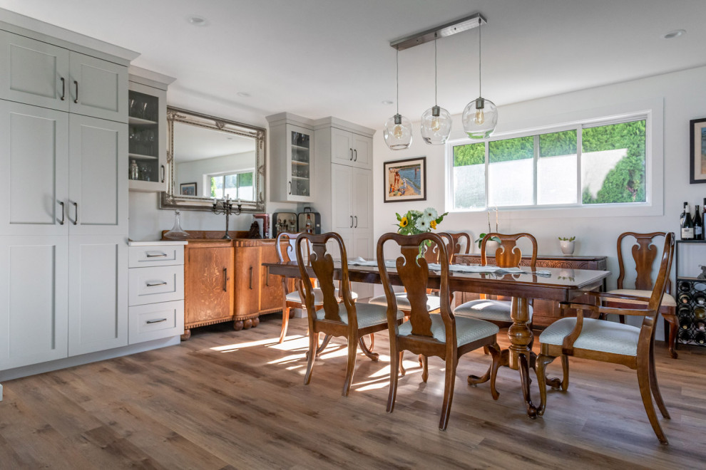 Kitchen/dining room combo - mid-sized transitional dark wood floor and brown floor kitchen/dining room combo idea with white walls