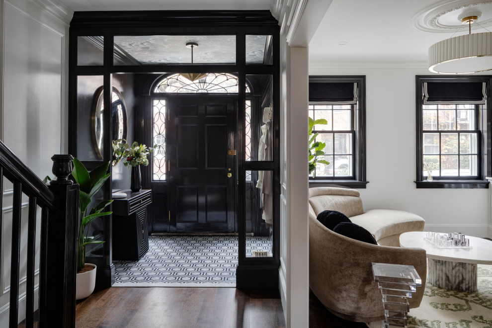Mid-sized transitional porcelain tile and white floor entryway photo in Boston with black walls and a black front door