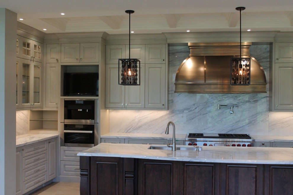 Example of a transitional kitchen design in Calgary