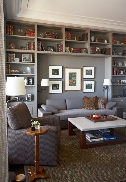 Photo of a mid-sized traditional open concept family room in Los Angeles with a library, grey walls and dark hardwood floors.
