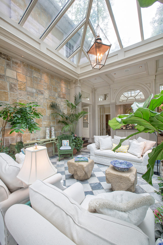 Design ideas for a large traditional enclosed family room in Omaha with white walls and marble floors.