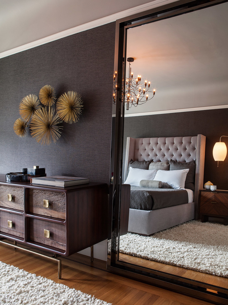 Inspiration for a mid-sized modern master bedroom in San Francisco with black walls and medium hardwood floors.