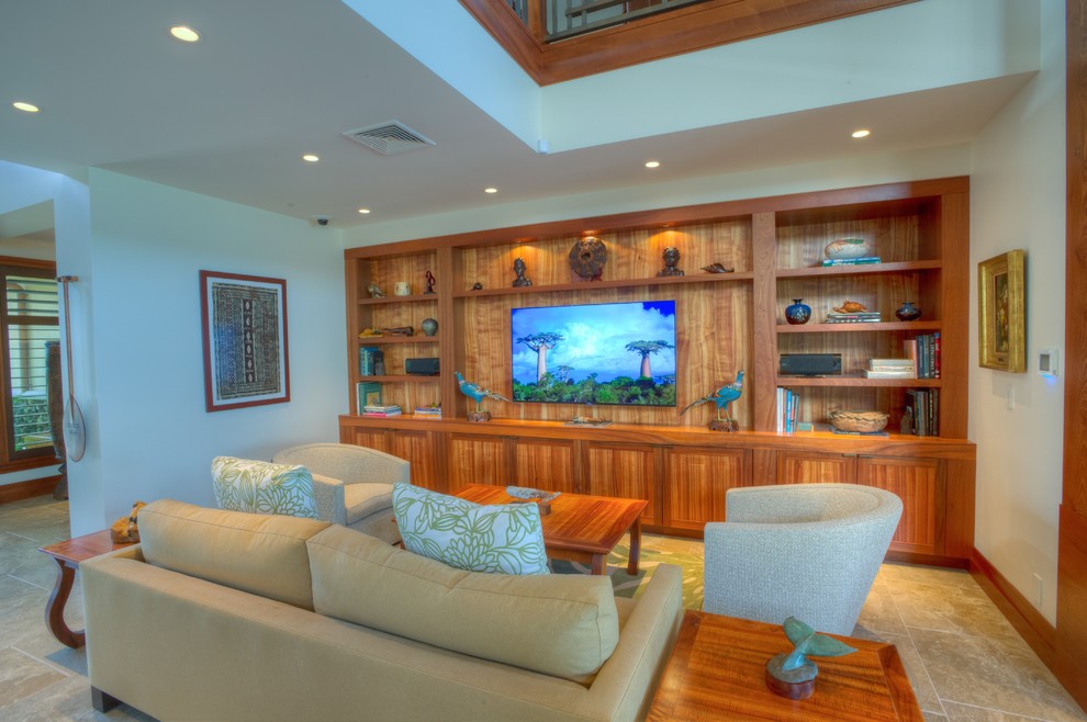 Photo of a mid-sized tropical living room in Hawaii with a built-in media wall, white walls and porcelain floors.