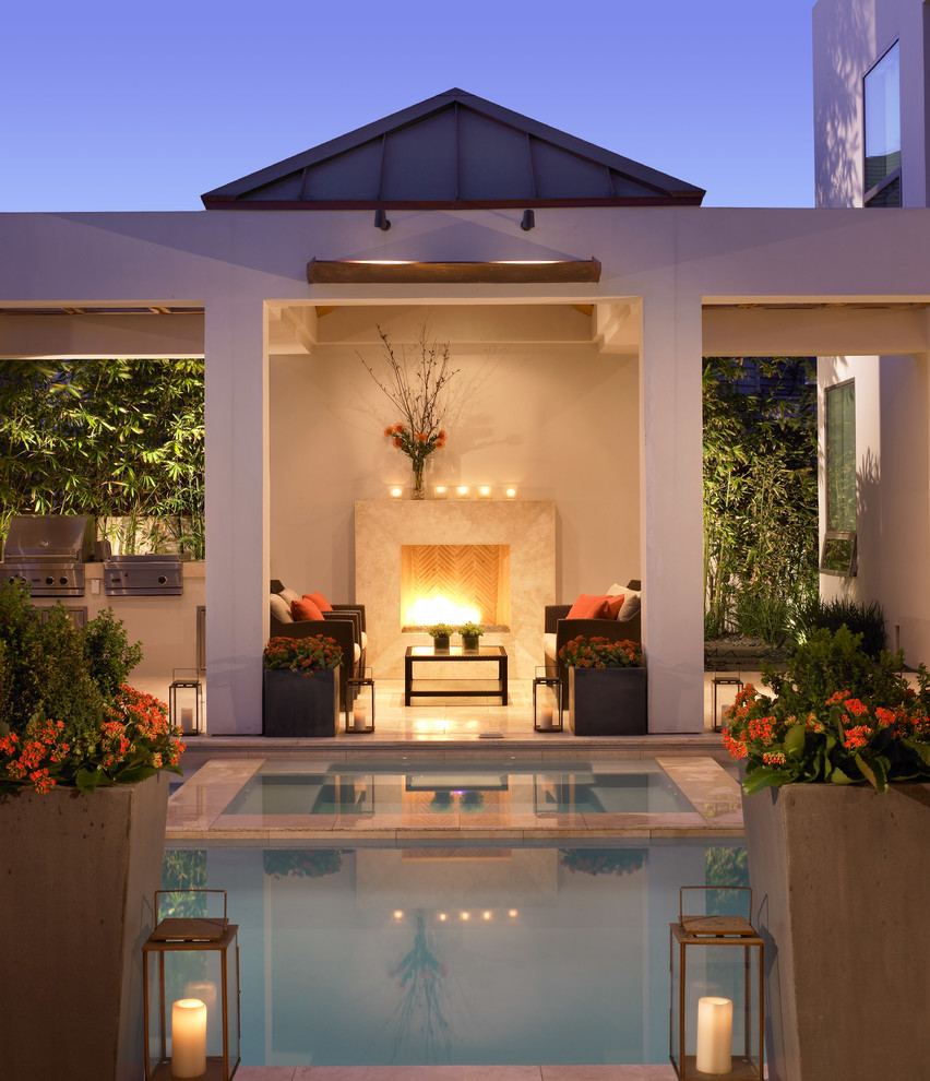Design ideas for a contemporary backyard pool in San Diego with a hot tub.