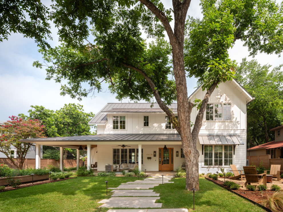 Ramsey House - Example of a mid-sized farmhouse white two-story concrete fiberboard and clapboard gable roof design in Austin with a metal roof and a gray roof