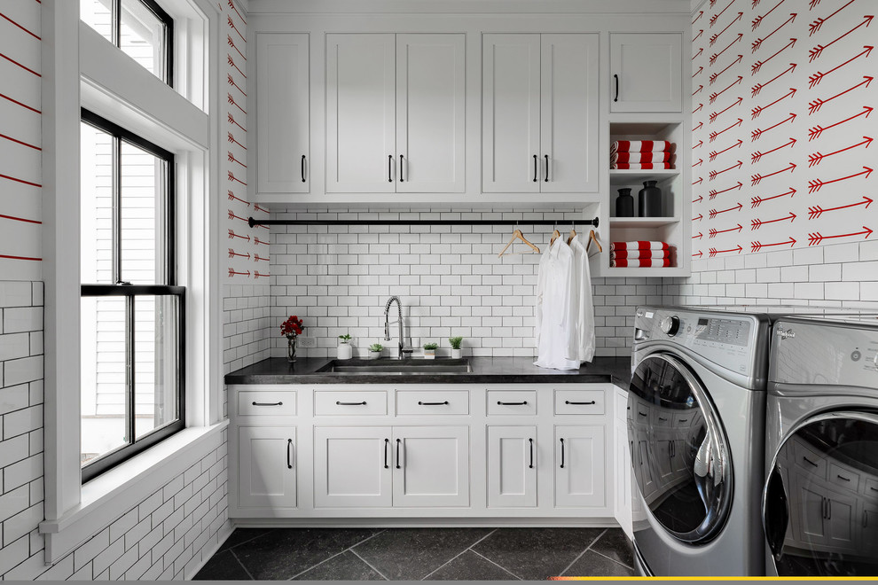 Inspiration for a large country l-shaped utility room in New York with shaker cabinets, white cabinets, white walls, slate floors, a side-by-side washer and dryer, black floor, black benchtop and an undermount sink.