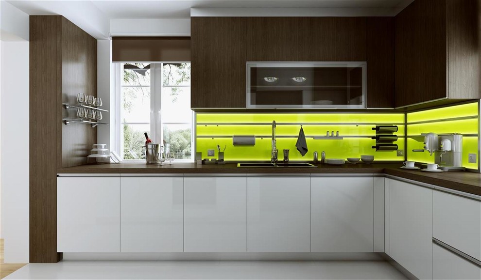 Example of a small minimalist single-wall medium tone wood floor and beige floor eat-in kitchen design with an undermount sink, flat-panel cabinets, gray cabinets, quartz countertops, beige backsplash, glass sheet backsplash, stainless steel appliances and no island