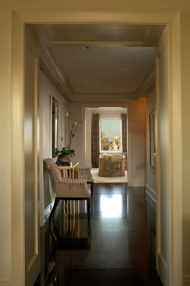 Inspiration for a mid-sized transitional foyer in New York with beige walls.