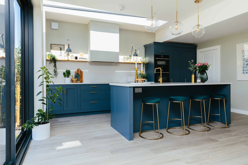 Inspiration for a modern kitchen in Surrey with grey floors.