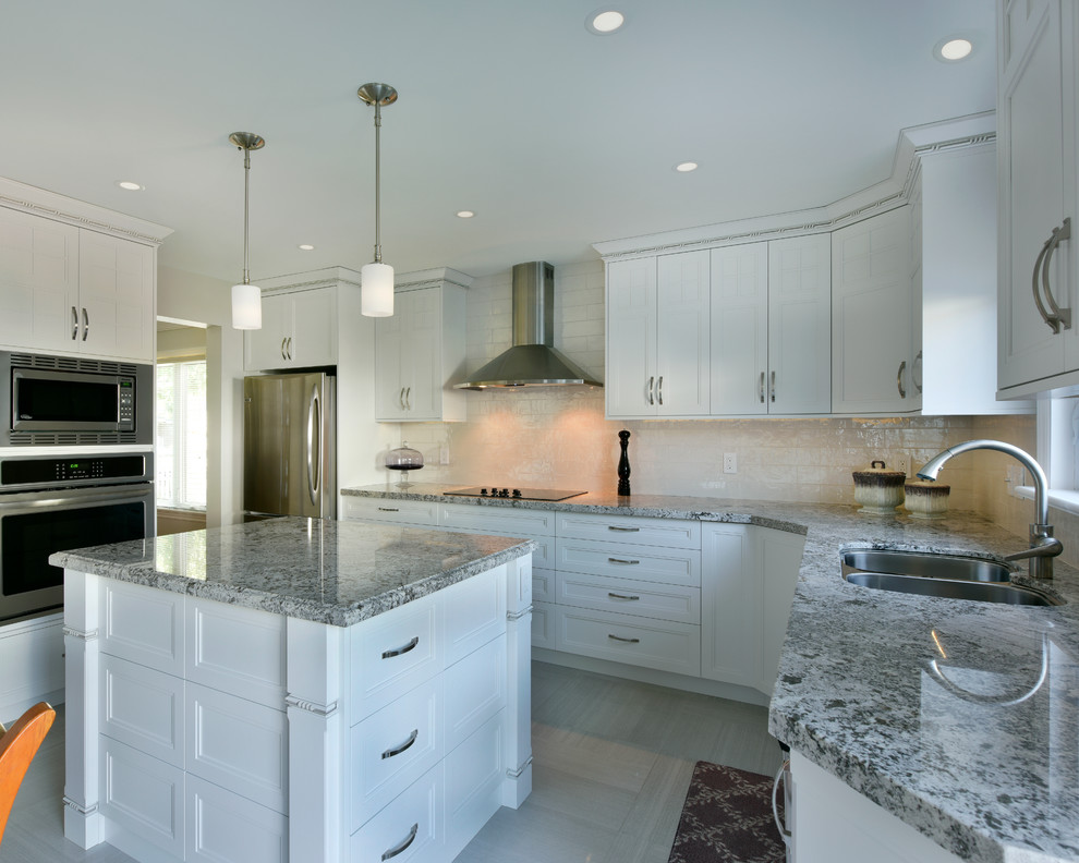 This is an example of a mid-sized transitional u-shaped eat-in kitchen in Ottawa with an undermount sink, beaded inset cabinets, white cabinets, granite benchtops, white splashback, ceramic splashback, stainless steel appliances, ceramic floors and with island.