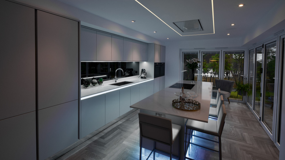 Immagine di una cucina moderna con lavello sottopiano, ante lisce, paraspruzzi grigio, paraspruzzi a specchio, elettrodomestici neri e top bianco