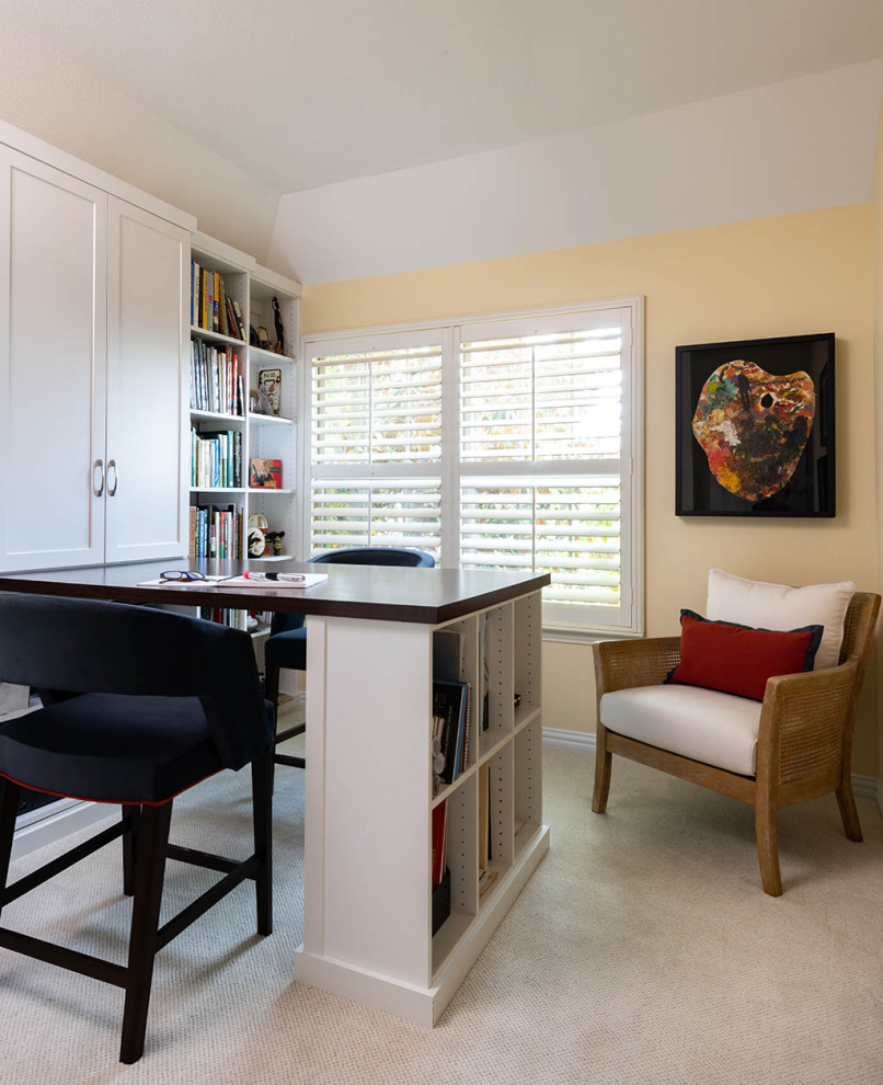 Inspiration for a home office in Dallas with a library, yellow walls, no fireplace, a built-in desk and vaulted.