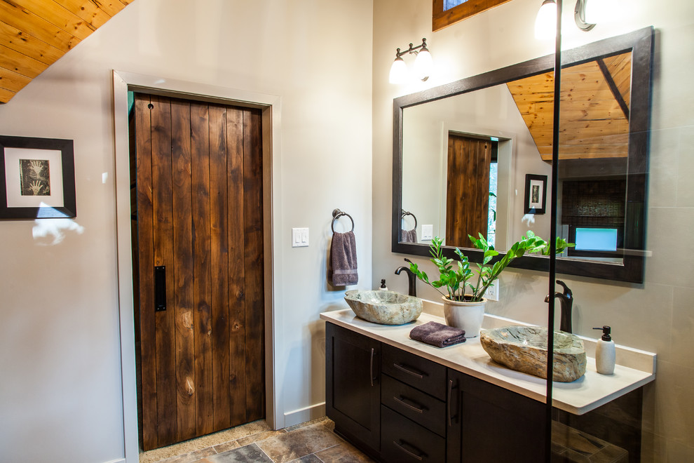 Inspiration for a mid-sized rustic master multicolored tile and porcelain tile porcelain tile and multicolored floor freestanding bathtub remodel with a vessel sink, shaker cabinets, quartz countertops, a one-piece toilet, gray walls and dark wood cabinets