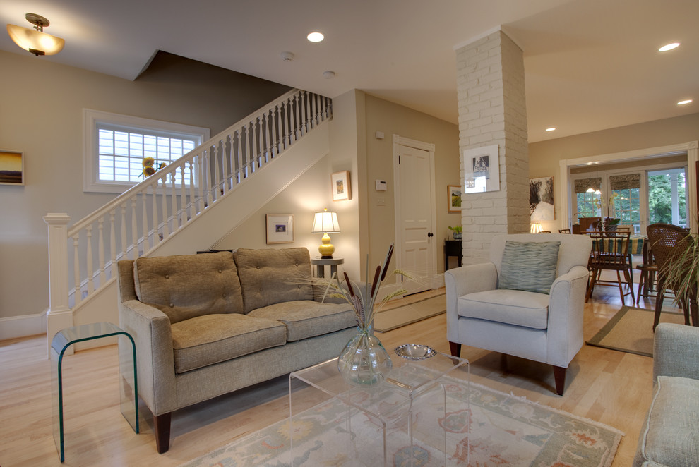 Photo of a contemporary open concept living room in DC Metro with beige walls.