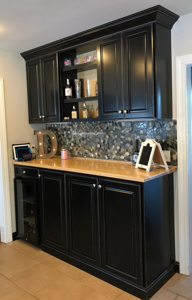 Inspiration for a mid-sized contemporary single-wall home bar in Louisville with raised-panel cabinets, black cabinets, wood benchtops, multi-coloured splashback and stone tile splashback.
