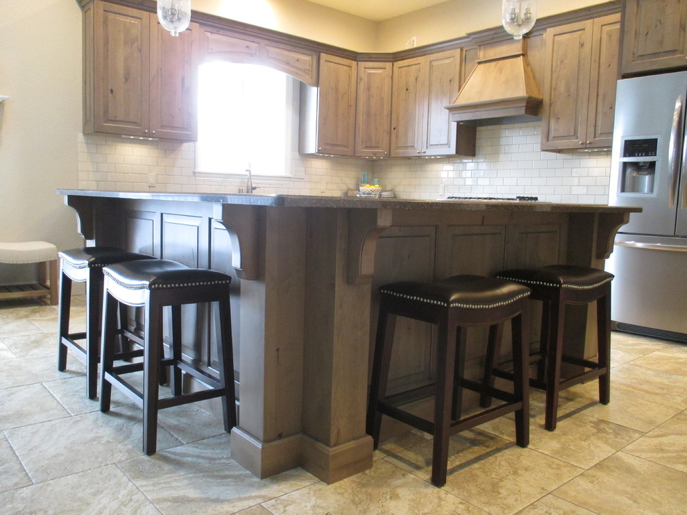 Inspiration for a mid-sized transitional l-shaped ceramic tile open concept kitchen remodel with an undermount sink, raised-panel cabinets, beige backsplash, subway tile backsplash, stainless steel appliances, an island, medium tone wood cabinets and quartz countertops