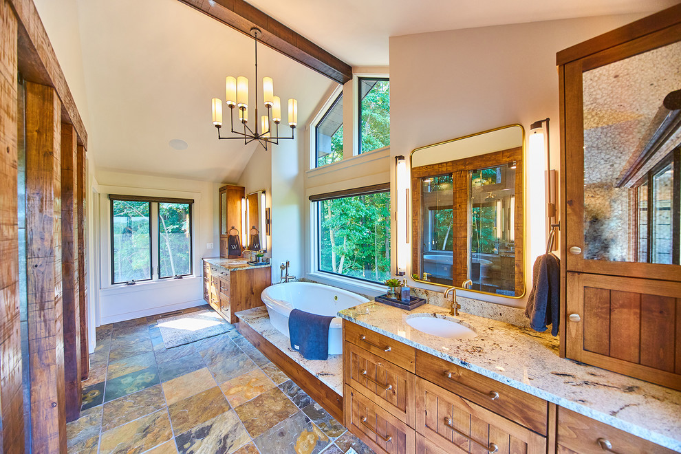 Design ideas for a large country master bathroom in Other with slate floors, an undermount sink and granite benchtops.