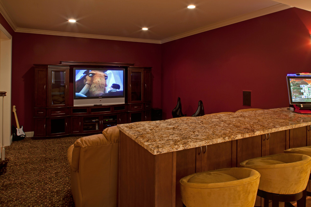 Photo of a mid-sized traditional enclosed home theatre in DC Metro with red walls and carpet.