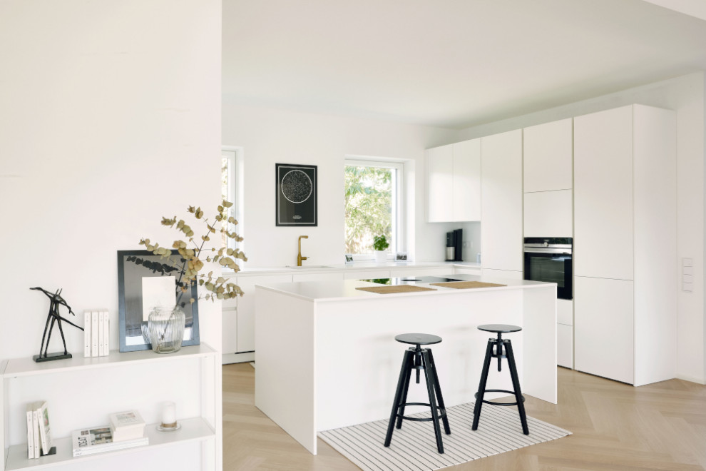 Idéer för att renovera ett mellanstort minimalistiskt kök, med en köksö