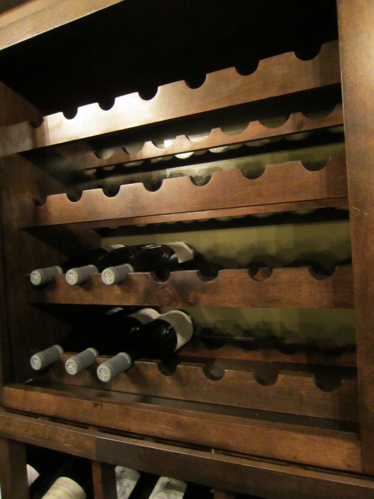 Photo of a mid-sized traditional wine cellar in New Orleans with marble floors and storage racks.