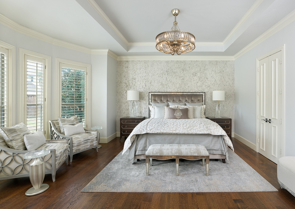 Design ideas for a large transitional master bedroom in Dallas with blue walls, dark hardwood floors and brown floor.