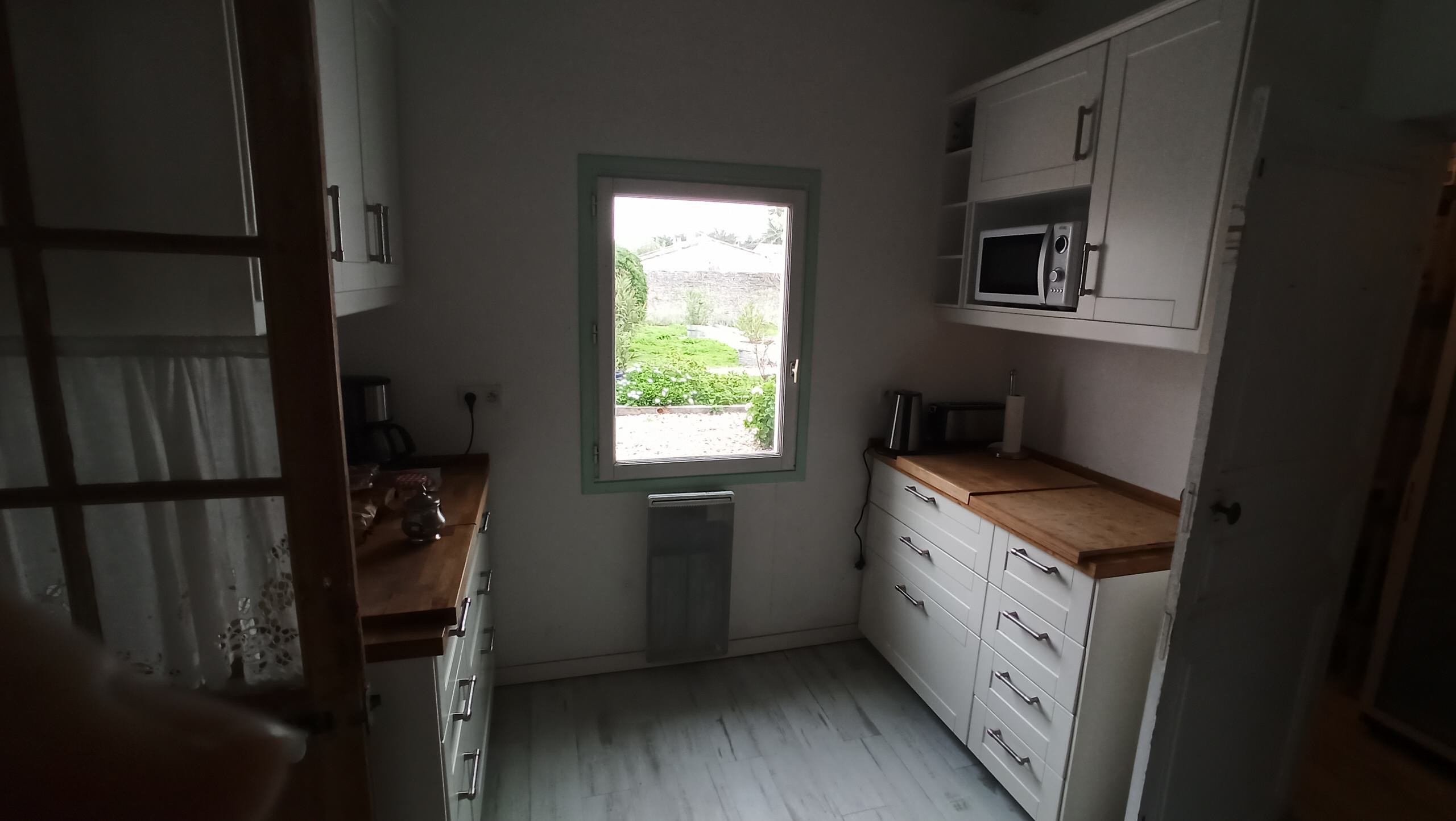 Transformation d'une chambre parentale en pièce de vie/cuisine